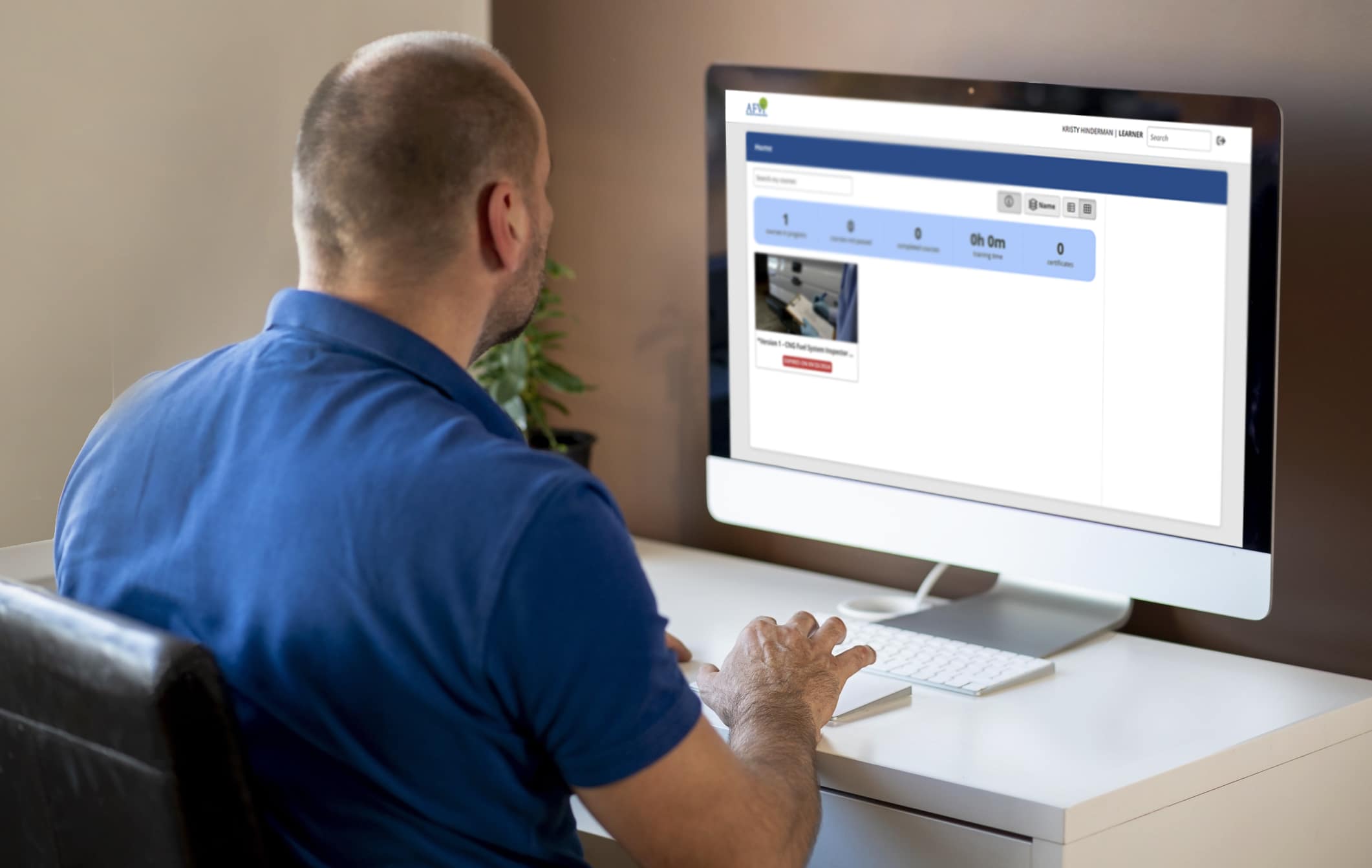 A CNG vehicle technician accesses the updated CNG Fuel System Inspector Certification Exam on their computer.